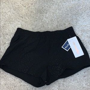 Black cheetah print athletic shorts
